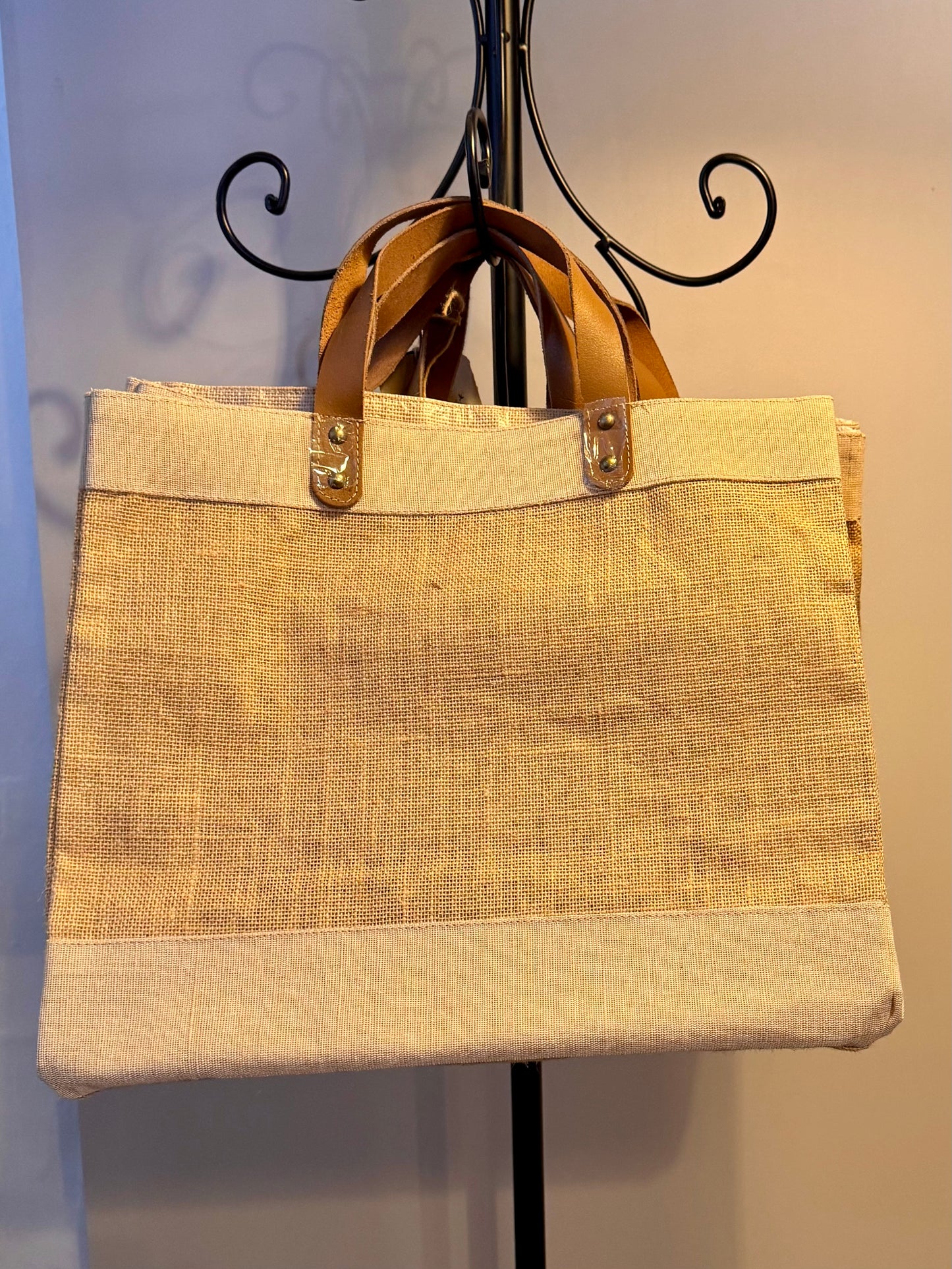 Hessian shopping bag with leather handles.
